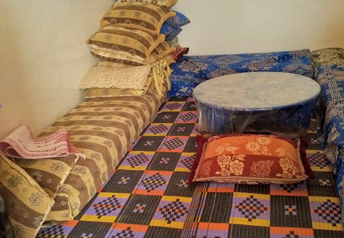 A shared room with mattresses and bedding laid out.